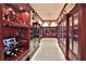 Impressive gun room with wood cabinets and display cases at 1485 Se 59Th St, Ocala, FL 34480