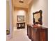 Bright hallway with hardwood floors, ornate mirror and console table at 1485 Se 59Th St, Ocala, FL 34480