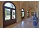 Elegant entry hall with arched doorways and blue vase at 1485 Se 59Th St, Ocala, FL 34480