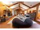 Spacious living area with high ceilings, wood beams, a fireplace, and ample seating at 3630 Ne 67Th Ter, Silver Springs, FL 34488