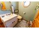 Powder room with a vanity and toilet at 3630 Ne 67Th Ter, Silver Springs, FL 34488