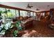 Bright sunroom showcasing comfortable seating and large windows at 3630 Ne 67Th Ter, Silver Springs, FL 34488