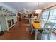 Bright dining area with hardwood floors and a view into the kitchen at 3630 Ne 67Th Ter, Silver Springs, FL 34488