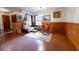 Cozy sitting area with wood walls, comfortable seating, and a window overlooking the outdoors at 3630 Ne 67Th Ter, Silver Springs, FL 34488