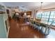 Bright kitchen features an island, ample counter space, and a dining area with wood flooring at 3630 Ne 67Th Ter, Silver Springs, FL 34488