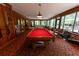 Spacious game room with a pool table and plenty of seating at 3630 Ne 67Th Ter, Silver Springs, FL 34488