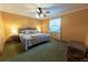 Bedroom with a queen-size bed and carpet floors at 3630 Ne 67Th Ter, Silver Springs, FL 34488