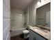 Bathroom with single vanity, tub, and shower combination at 4489 Sw 90Th Pl, Ocala, FL 34476