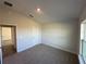 Spacious bedroom with plush carpeting and ample natural light at 4489 Sw 90Th Pl, Ocala, FL 34476