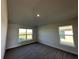Spacious bedroom with carpet flooring and large windows at 4489 Sw 90Th Pl, Ocala, FL 34476