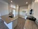 Modern kitchen with granite countertops and ample cabinet space at 4489 Sw 90Th Pl, Ocala, FL 34476