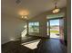 Open living area showcasing wood-look tile and backyard views at 4489 Sw 90Th Pl, Ocala, FL 34476