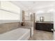 Elegant bathroom with double vanity, soaking tub, and glass shower at 4710 Sw 65Th Pl, Ocala, FL 34474