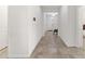 Bright and spacious hallway with tile flooring and access to other rooms at 4710 Sw 65Th Pl, Ocala, FL 34474