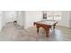 A game room with a pool table and tiled floors at 4710 Sw 65Th Pl, Ocala, FL 34474