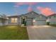 Two-story house with two-car garage and light-colored siding at 4710 Sw 65Th Pl, Ocala, FL 34474