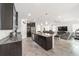 Modern kitchen with dark wood cabinets and granite countertops at 4710 Sw 65Th Pl, Ocala, FL 34474