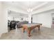 Game room with pool table and open floor plan to living area at 4710 Sw 65Th Pl, Ocala, FL 34474