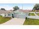 Aerial view of a light blue two-story house at 4710 Sw 65Th Pl, Ocala, FL 34474