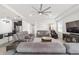 Spacious living room with plush seating and a view into the kitchen at 4710 Sw 65Th Pl, Ocala, FL 34474