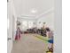 Large playroom with plenty of storage and toys at 4710 Sw 65Th Pl, Ocala, FL 34474