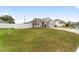 Newly built home with a manicured lawn and white fence at 4710 Sw 65Th Pl, Ocala, FL 34474