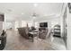 Open living room featuring comfortable seating, a large TV, and tile floors at 4710 Sw 65Th Pl, Ocala, FL 34474