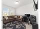 Bright home office features a large sectional sofa, workspace, and ample natural light at 4710 Sw 65Th Pl, Ocala, FL 34474