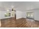 Open living room with vinyl flooring and sliding doors at 903 Aloha Way, Lady Lake, FL 32159