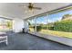 Spacious screened porch overlooks a lush green backyard with a tranquil water view at 903 Aloha Way, Lady Lake, FL 32159