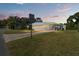 Mobile home with carport and a well-kept lawn at 903 Aloha Way, Lady Lake, FL 32159