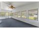 Sunroom with ceiling fan and lots of natural light at 903 Aloha Way, Lady Lake, FL 32159