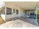 Covered patio with golf cart and access to the home at 903 Aloha Way, Lady Lake, FL 32159