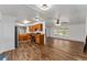 Open concept kitchen with wood cabinets and vinyl flooring at 903 Aloha Way, Lady Lake, FL 32159