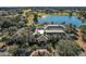 Community clubhouse with surrounding landscape at 9450 Se 130Th Place Rd, Summerfield, FL 34491
