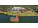 Clubhouse with dock and gazebo over water at 9450 Se 130Th Place Rd, Summerfield, FL 34491