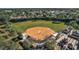 Community baseball field with seating and facilities at 9450 Se 130Th Place Rd, Summerfield, FL 34491