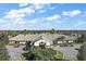 Community clubhouse with parking area at 9450 Se 130Th Place Rd, Summerfield, FL 34491