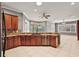 Island kitchen with stainless steel appliances and granite countertops at 9450 Se 130Th Place Rd, Summerfield, FL 34491