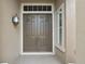Double front doors with sidelights and a lantern at 9450 Se 130Th Place Rd, Summerfield, FL 34491