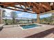 Relaxing hot tub with covered patio overlooking lake at 9450 Se 130Th Place Rd, Summerfield, FL 34491