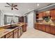 Kitchen features granite countertops, a double sink, and wood cabinets at 9450 Se 130Th Place Rd, Summerfield, FL 34491
