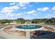 Community entrance with circular fountain at 9450 Se 130Th Place Rd, Summerfield, FL 34491