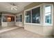 Spacious sunroom with tiled floors and large windows at 9450 Se 130Th Place Rd, Summerfield, FL 34491