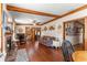 Spacious living room with hardwood floors, fireplace, and couch at 10135 Se 108Th Terrace Rd, Ocala, FL 34472