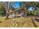 House exterior showcasing a side view and large yard at 10135 Se 108Th Terrace Rd, Ocala, FL 34472