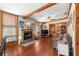 Living room with hardwood floors, fireplace, and ceiling fan at 10135 Se 108Th Terrace Rd, Ocala, FL 34472