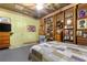 Bedroom with unique wood-paneled walls and a comfy bed at 10135 Se 108Th Terrace Rd, Ocala, FL 34472