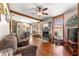 Living room with hardwood floors, fireplace, and a cozy atmosphere at 10135 Se 108Th Terrace Rd, Ocala, FL 34472