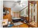 Bathroom with clawfoot tub, wood paneling, and a vintage aesthetic at 10135 Se 108Th Terrace Rd, Ocala, FL 34472